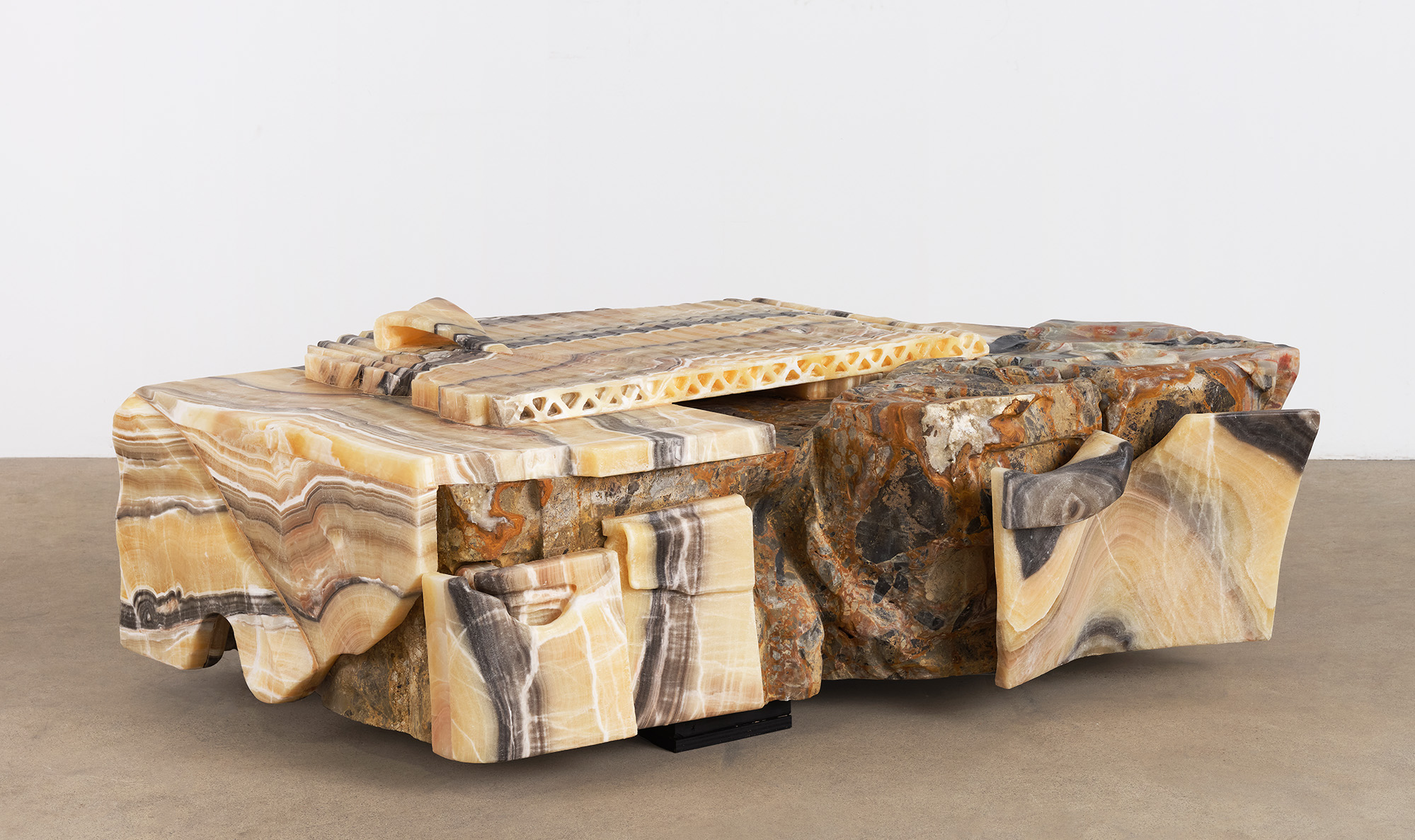 A stone coffee table by Misha Kahn.